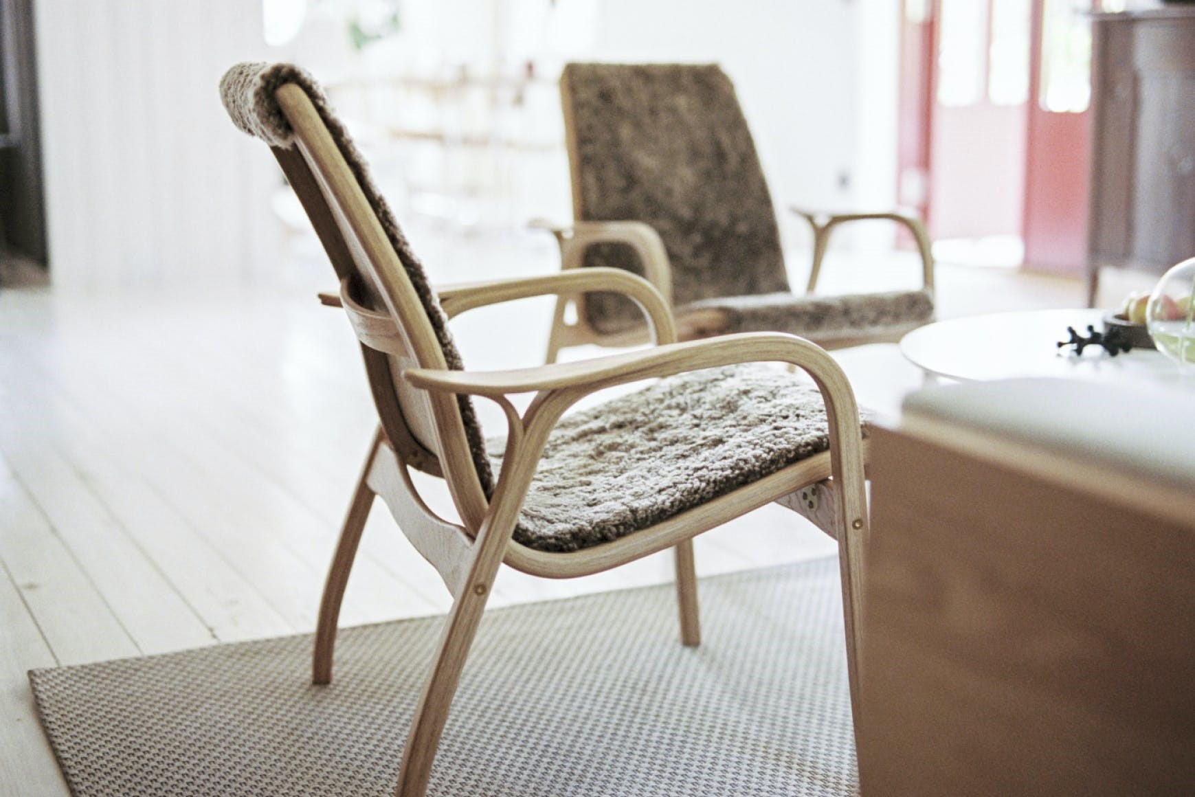 Sheepskin-covered Laminett chair by SitOnIt Seating